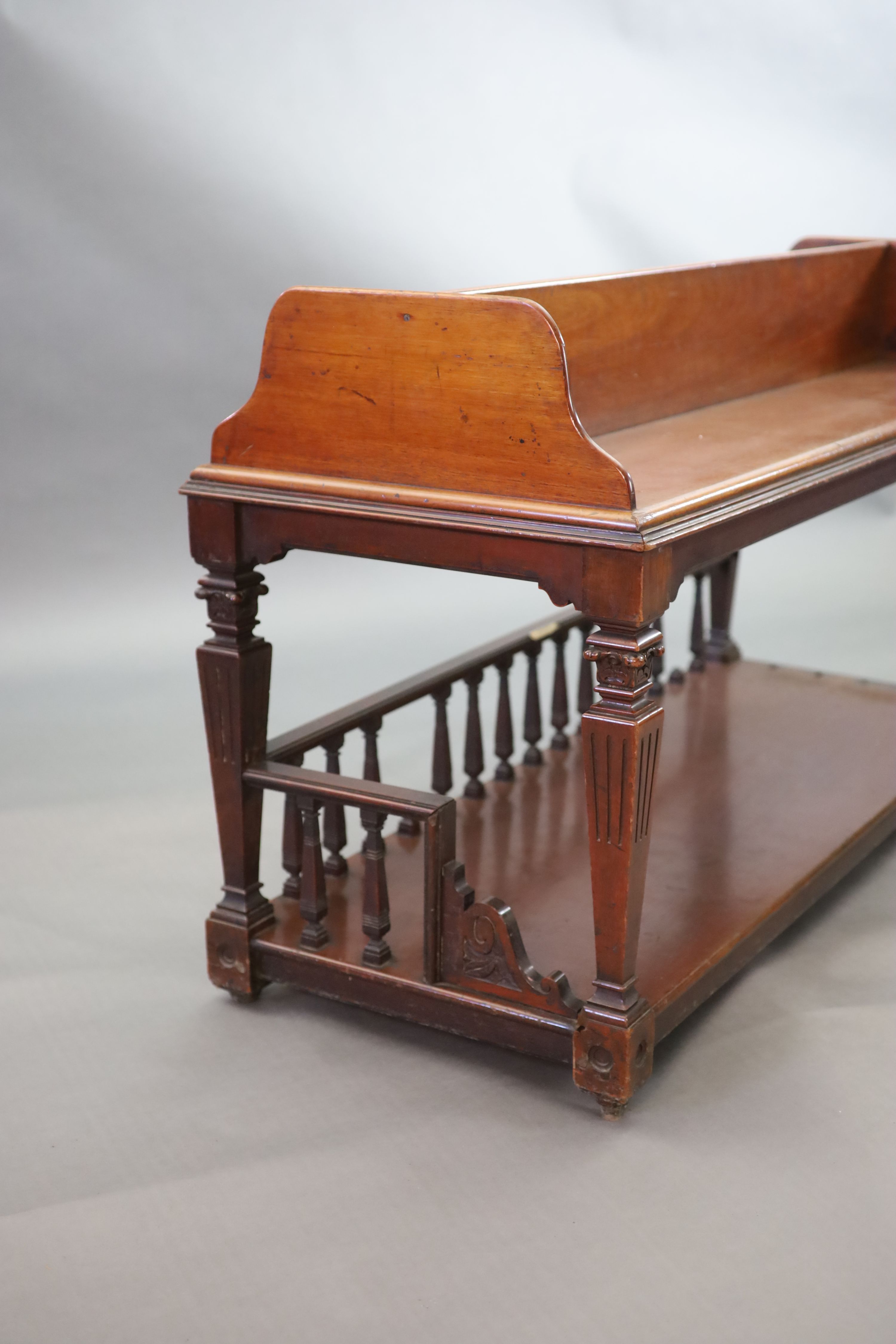 A Victorian mahogany freestanding bookcase, supplied by Sage & Company Shopfitters of London, W.131cm D.51cm H.76cm